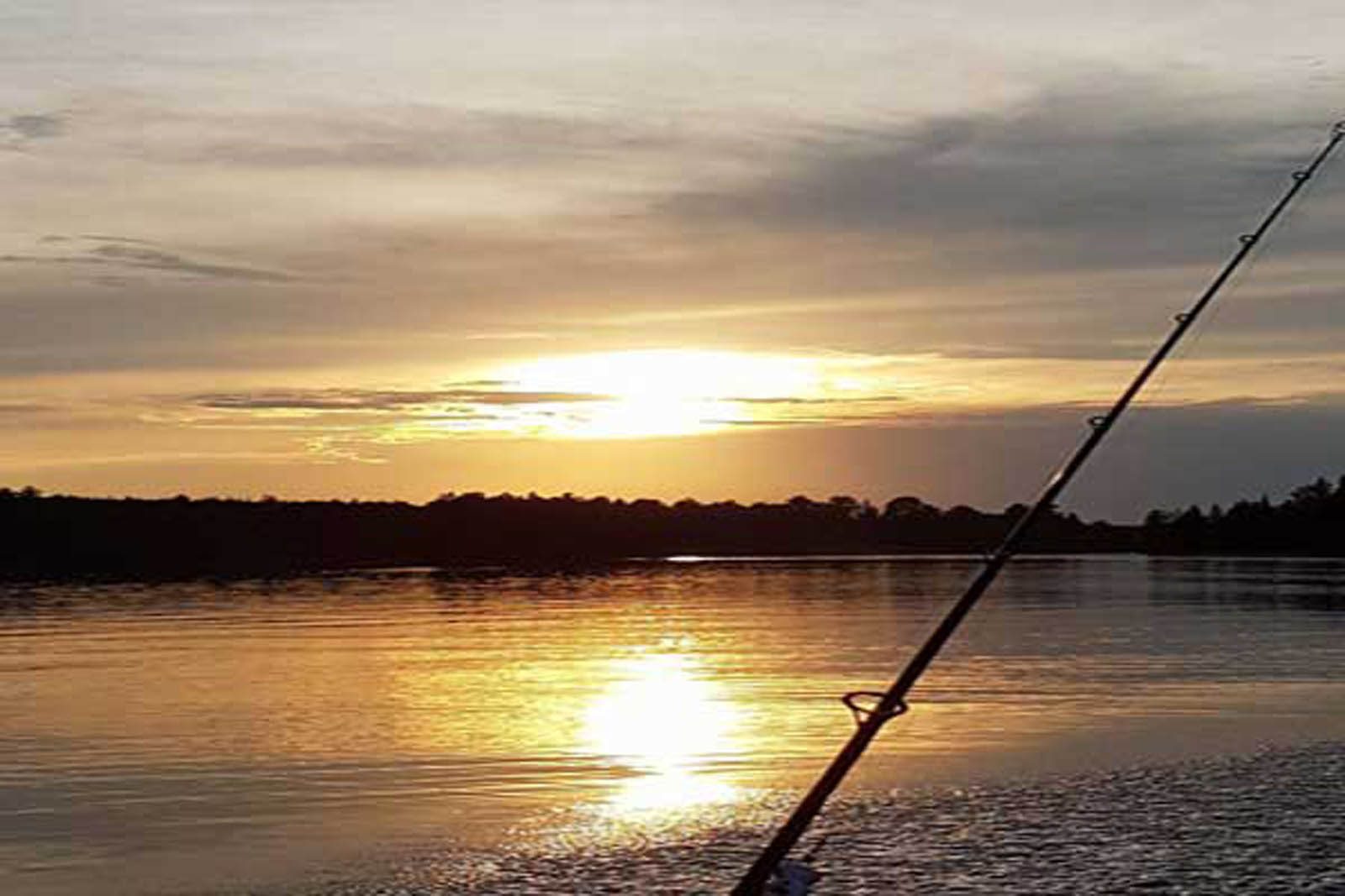 Fishing at sunset on the lake